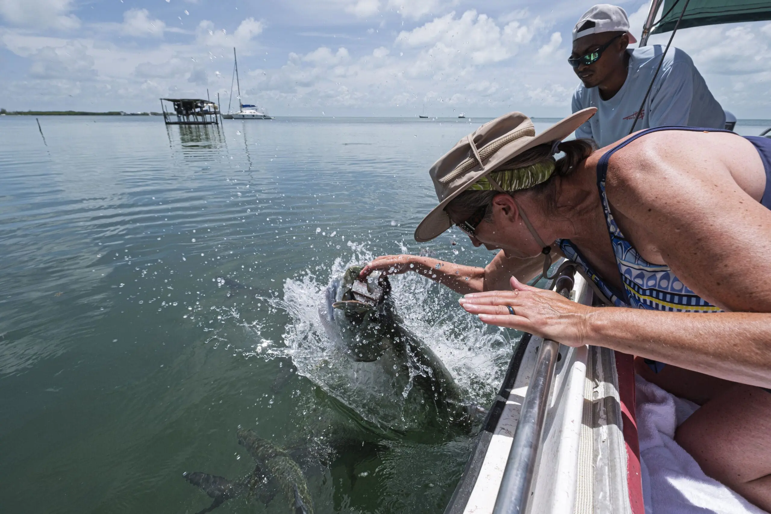 Woman touches fish